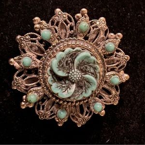 Silver tone with turquoise colored stones brooch